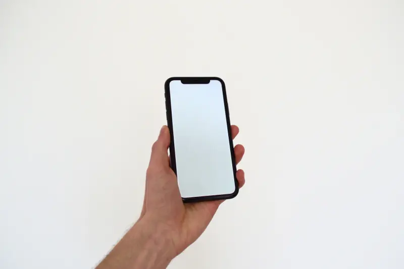 Een hand met een telefoon